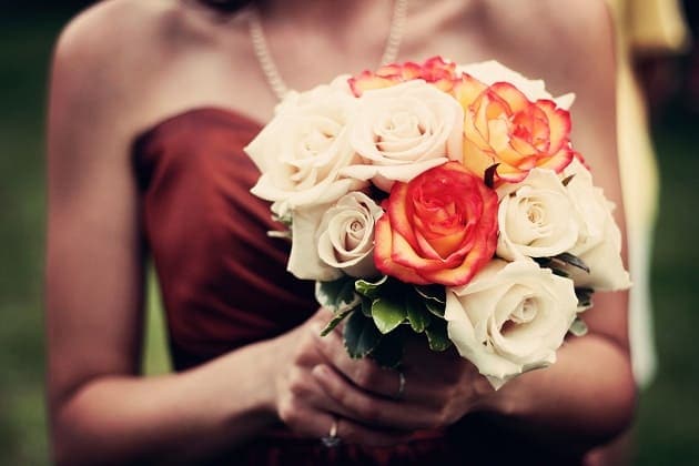 Holding a wedding bouquet