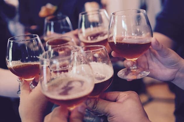 Glasses being clinked during a toast