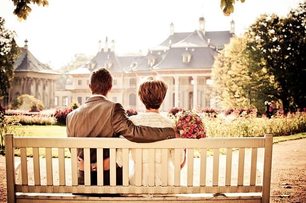 Wedding couple sat on a bench